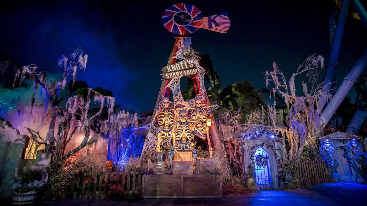 exterior view of gate entrance to Knott's Scary Farm at night with lights in Los Angeles, California, USA